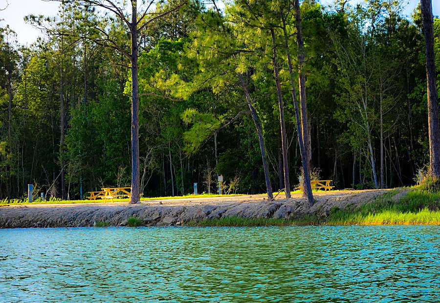Full-hookup RV sites with concrete pads along the lake at Lake LaCroix in Bay St. Louis