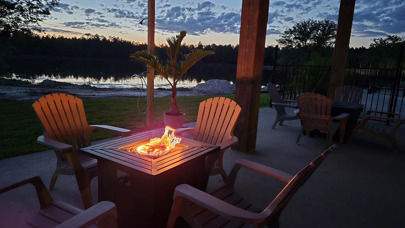 Lakeside fire pit and Adirondack chairs at dusk at Lake LaCroix