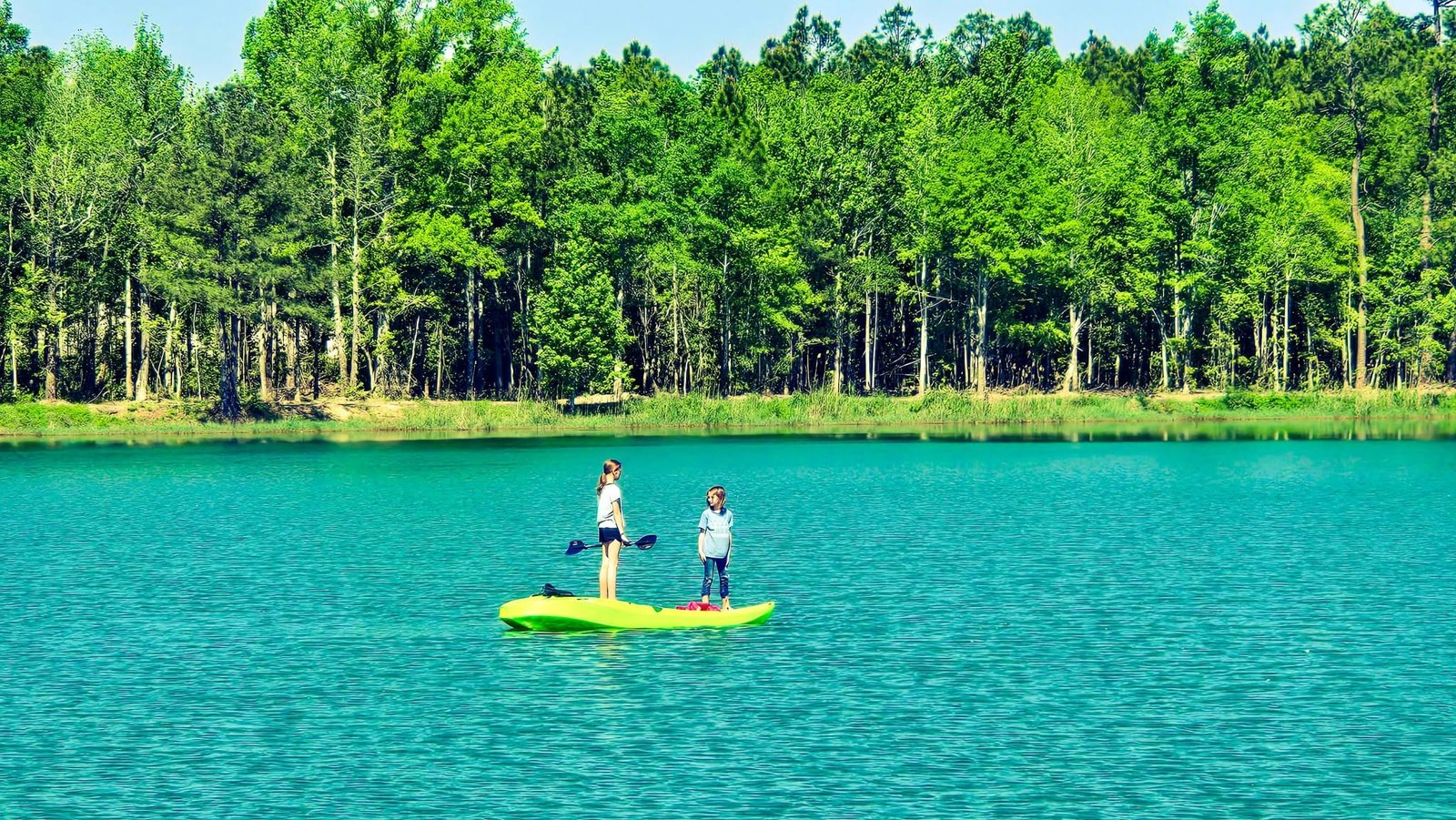Paddleboarding on the clear turquoise lake at Lake LaCroix
