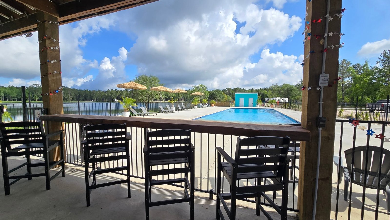 Covered pavilion bar overlooking the pool at Lake LaCroix