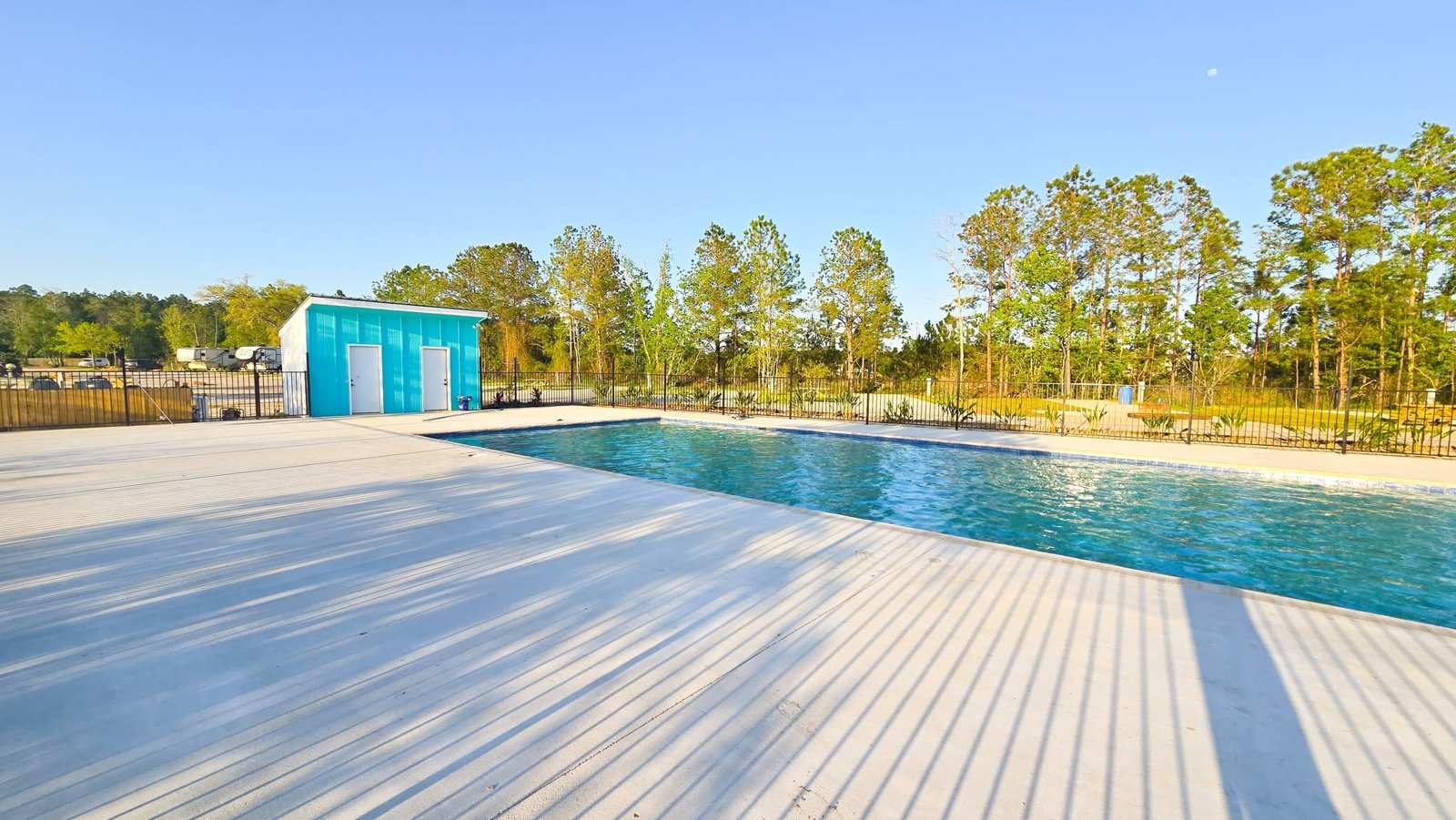 Sun deck beside the swimming pool at Lake LaCroix RV Resort