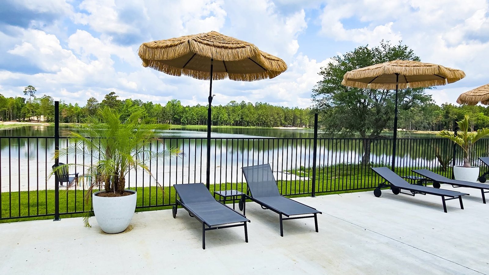 Resort swimming pool with shaded loungers at Lake LaCroix RV Resort