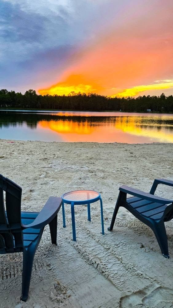 Sunset from the beach chairs at Lake LaCroix RV Resort