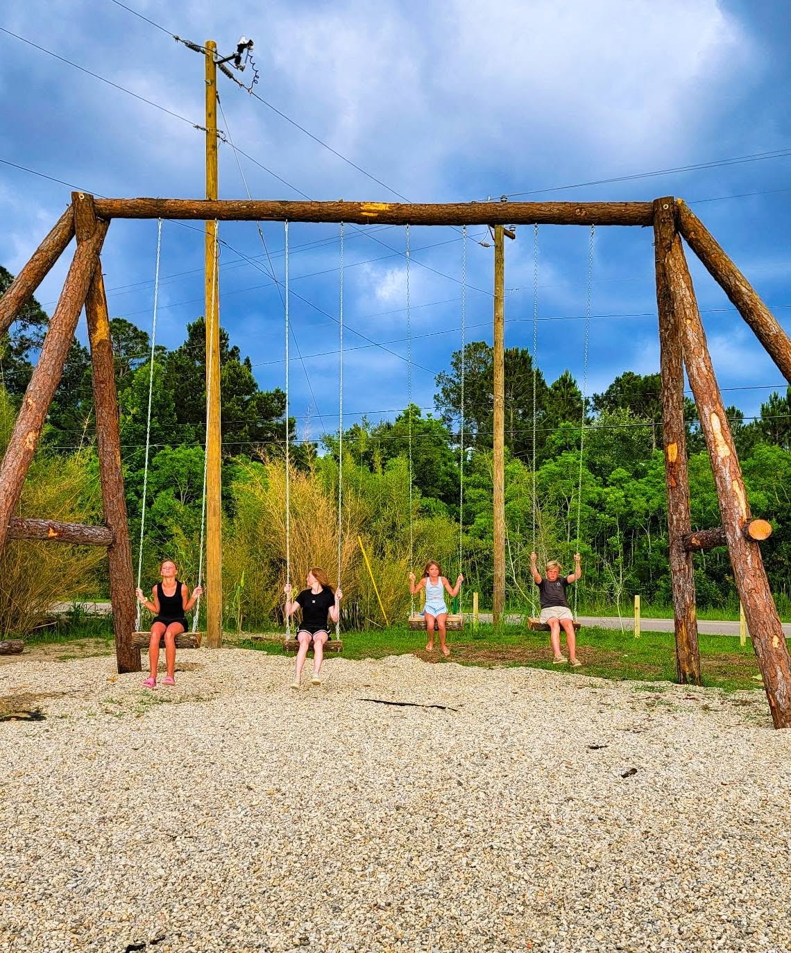 Kids on the beach swings at Lake LaCroix RV Resort