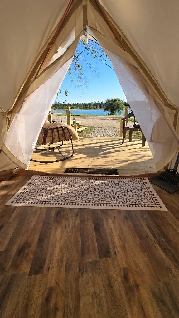 View of the lake from inside a glamping tent at Lake LaCroix